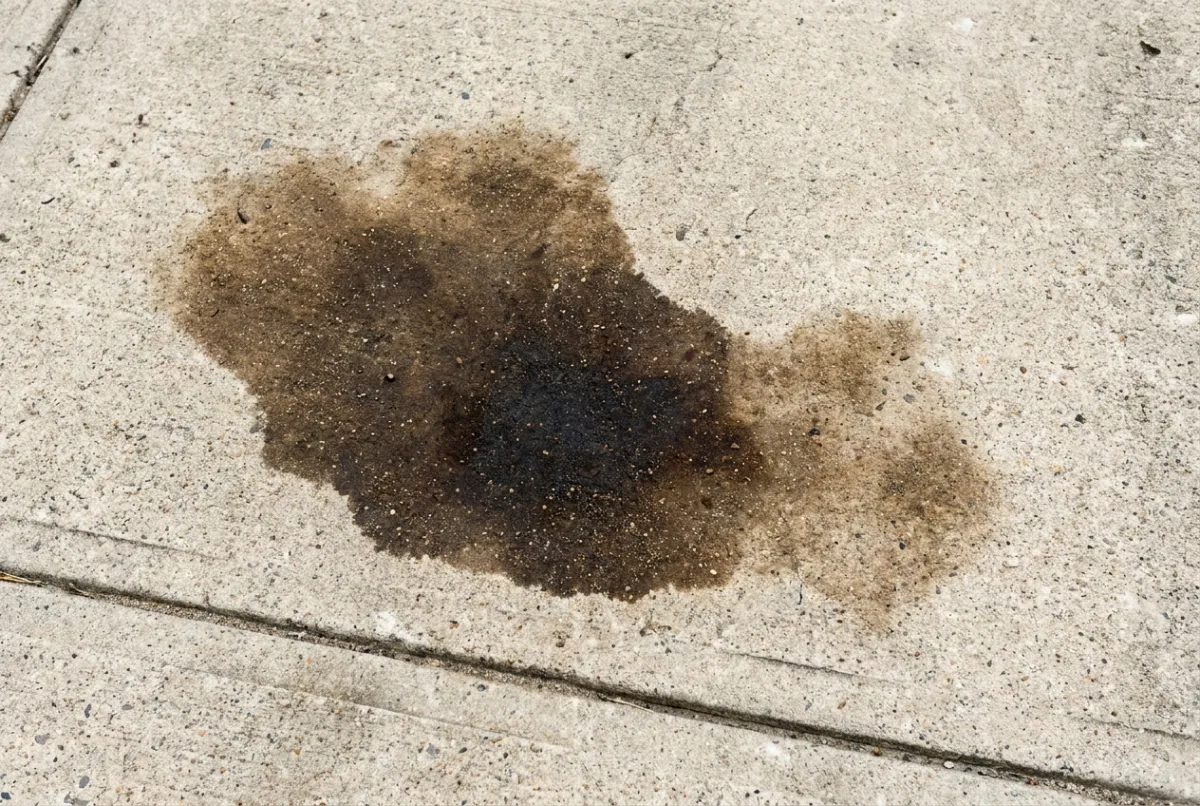 Illustrative image: Oil staining on a concrete driveway